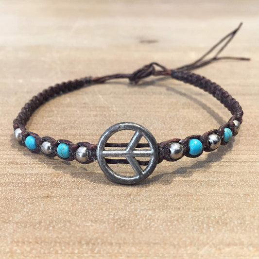 Pulsera trenzada con cordón de cera y símbolo de paz